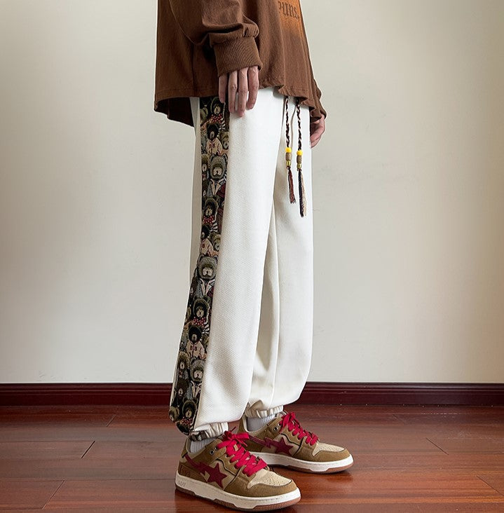 Spodnie dresowe z nadrukiem Bryan Kostle